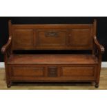 An early 20th century oak hall bench, rectangular back with three raised and fielded panels,