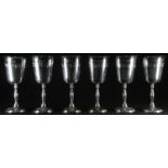 A set of six Elizabeth II silver wine goblets, each bell shaped bowl and domed foot engraved with