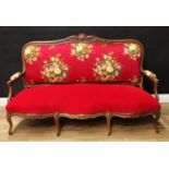 A 19th century mahogany sofa, in the French taste, shaped cresting rail carved with scrolling