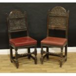 A near pair of 17th/early 18th century oak back stools, arched panel backs flanked by pyramidal