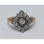 A 19th century diamond cluster ring, square panel crest inset with thirteen old mixed cut