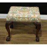 A George II style mahogany stool, stuffed-over seat, cabriole legs carved to the knees, ball and