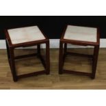 A pair of Chinese hardwood jardinière stands, square tops with inset soapstone panels, 43cm high,