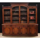A Victorian walnut library bookcase, central arched glazed doors flanked by further rectangular