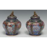 A pair of Chinese cloisonne baluster jars and covers, gilt temple lion finials, decorated in