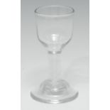 An unusual George III dram glass, ogee-shaped bowl, double-series opaque twist stem, domed plinth