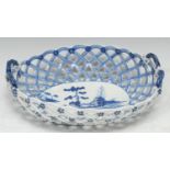 A Derby oval two handled basket, painted with a Chinese landscape in blue under glaze, rope handles,