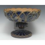 A large Doulton Lambeth stoneware table centre bowl, in relief with fruiting vine, in tones of