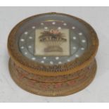 An unusual George III cut paper and mica circular snuff box and cover, the domed cover enclosing a