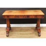 A William IV rosewood library table, rounded rectangular top above a deep frieze with two flush