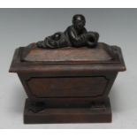 A Chinese dark patinated bronze mounted hardwood sarcophagus casket, the figural finial cast in