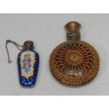 A 19th century silver coloured metal and enamel scent bottle, painted with sprays of summer