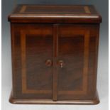 A late 19th century rosewood table cabinet, rounded rectangular top above a pair of doors