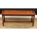 A Victorian mahogany window seat, rectangular top with arched reeded ends, turned legs, H-stretcher,
