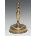 A late 17th century brass candlestick, cylindrical sconce, substantial domed base, 23cm high, c.1690