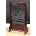 A Chinese hardwood rounded rectangular table screen, the banner with rectangular mirror, carved
