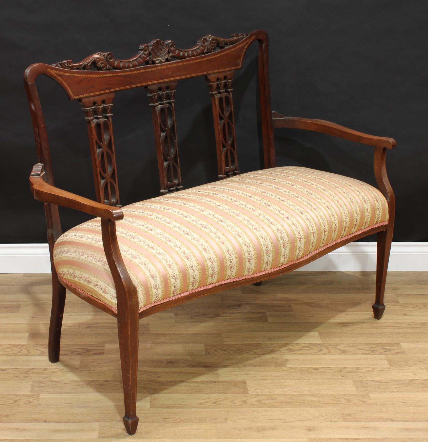 An Edwardian inlaid mahogany salon sofa, carved and pierced three panel back, tapering supports, - Image 2 of 2
