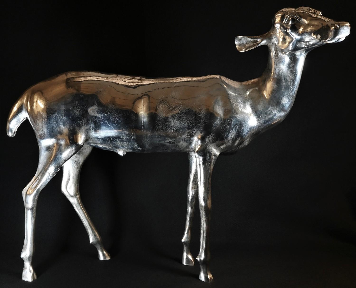 An imposing silver plated cast floor standing model, of a doe deer, 59cm high, 69cm wide, 20th