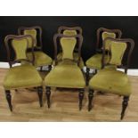 A set of six Victorian mahogany dining chairs, shaped backs with shield shaped splats, carved with