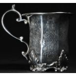 A 19th century Anglo-Indian silver paneled bell shaped mug, engraved with flowerheads, leafy scrolls