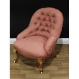 A Victorian walnut button-back nursing chair, stuffed over upholstery, cabriole legs, ceramic