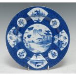 A Bow circular plate, decorated with alternating fan and roundel panels, with sampan, willow and