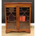 An Edwardian mahogany low bookcase, in the George III taste, dentil cornice above a pair of astragal