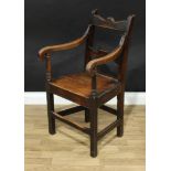 An early 19th century oak and elm vernacular armchair, shaped bar back, scroll arms, boarded seat,