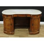 A Victorian walnut kidney shaped bed chamber desk or washstand, in the manner of Gillow of