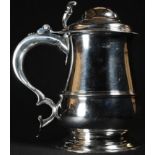 A George II silver baluster tankard, hinged domed cover, pierced thumbpiece, three-quarter girdle,