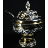 A Rococo silver-gilt ogee sugar box and cover, chased with flowers and leafy scrolls, domed circular
