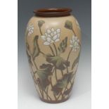 A Calvert and Lovatt Langley ovoid vase, in impasto and painted with lilies on a tan ground, 39cm