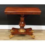 A William IV mahogany and parcel-gilt pedestal centre table, rounded rectangular top, baluster