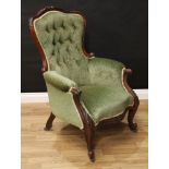 A Victorian rosewood drawing room chair, shaped back with carved serpentine cresting, scroll arms,
