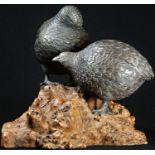 Japanese School (Meiji period), a brown patinated bronze group, a pair of quails, rootwood base,