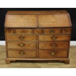 An unusual George III oak and burr elm double bureau, of idiosyncratic design, each fall front