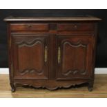 An 18th century Continental oak half cabinet, rounded rectangular top above a pair of frieze