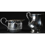 A Victorian silver spirally fluted oval cream jug, acanthus-capped scroll handle, 10cm high, John