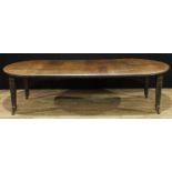 A late Victorian oak wind-out dining table, four additional leaves, fluted tapered square legs,