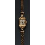 A lady's 9ct gold Tudor Rolex wristwatch, canted rectangular dial, creamy white square face, gilt