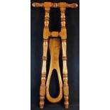 A Victorian country house walnut boot jack, turned handle and frame, 91.5cm long, c. 1870