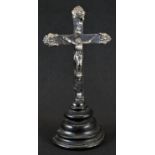 A North European silver and ebonised corpus christi, stepped demi-lune base, 27cm high