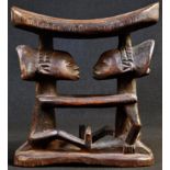 Tribal Art - a Luba caryatid headrest, carved with two figures embracing, elaborate coiffure,18cm