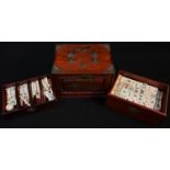 A Chinese Mahjong set, comprising one hundred and forty eight bone and bamboo tiles and further