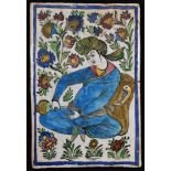 A Persian Islamic rectangular tile or panel, painted in the typical Qajar manner with a figure