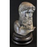 A museum-type verdigris patinated composition bust, after the ancient Greek, ebonised plinth, 26cm