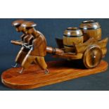 An Art Deco novelty tobacco compendium, as a pair of Chinese figures drawing a hand cart with two