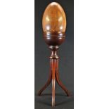 Treen - a large 19th turned lignum vitae egg shaped specimen, 21cm long; a mahogany tripod stand,