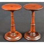A pair of George IV rosewood circular candle stands, shallow galleries, turned pillars and bases,