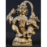 An Indian gilt bronze shrine figure, of Vishnu holding an infant, 13cm high, 19th century